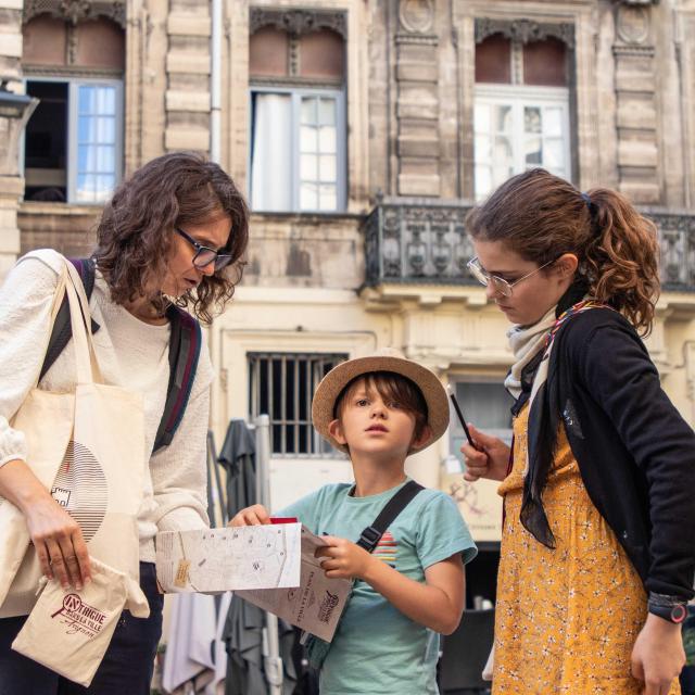 Family playing Intrigue in the City